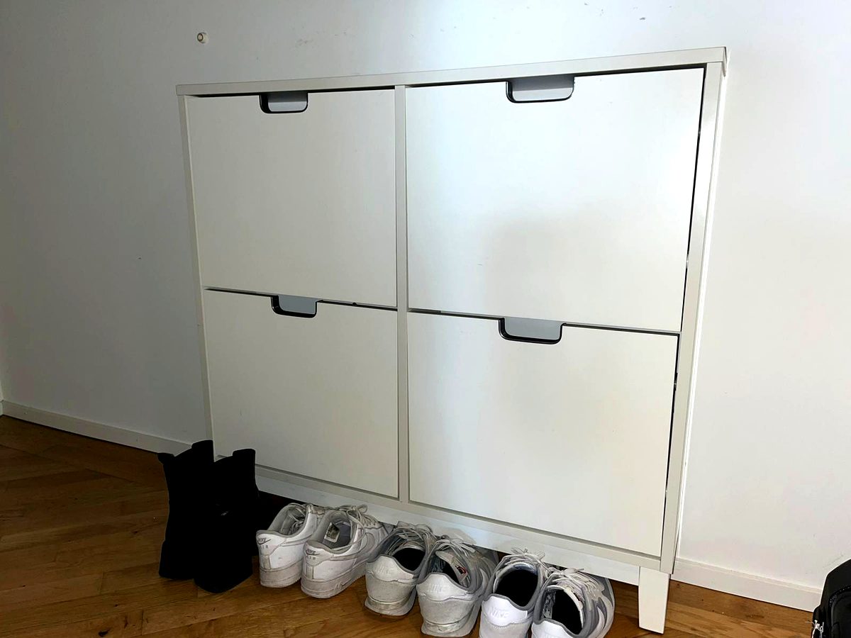 IKEA STÄLL shoe cabinet assembled and placed against wall